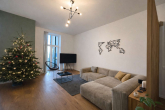 Wohnzimmer - FEINE 3-ZIMMER-WOHNUNG MIT GARTEN IN SPITZENLAGE